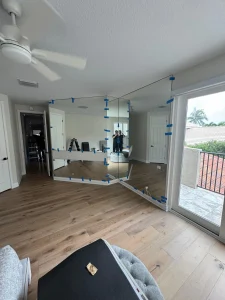 High-quality glass mirror for home decor, featuring a spacious living room with natural light.