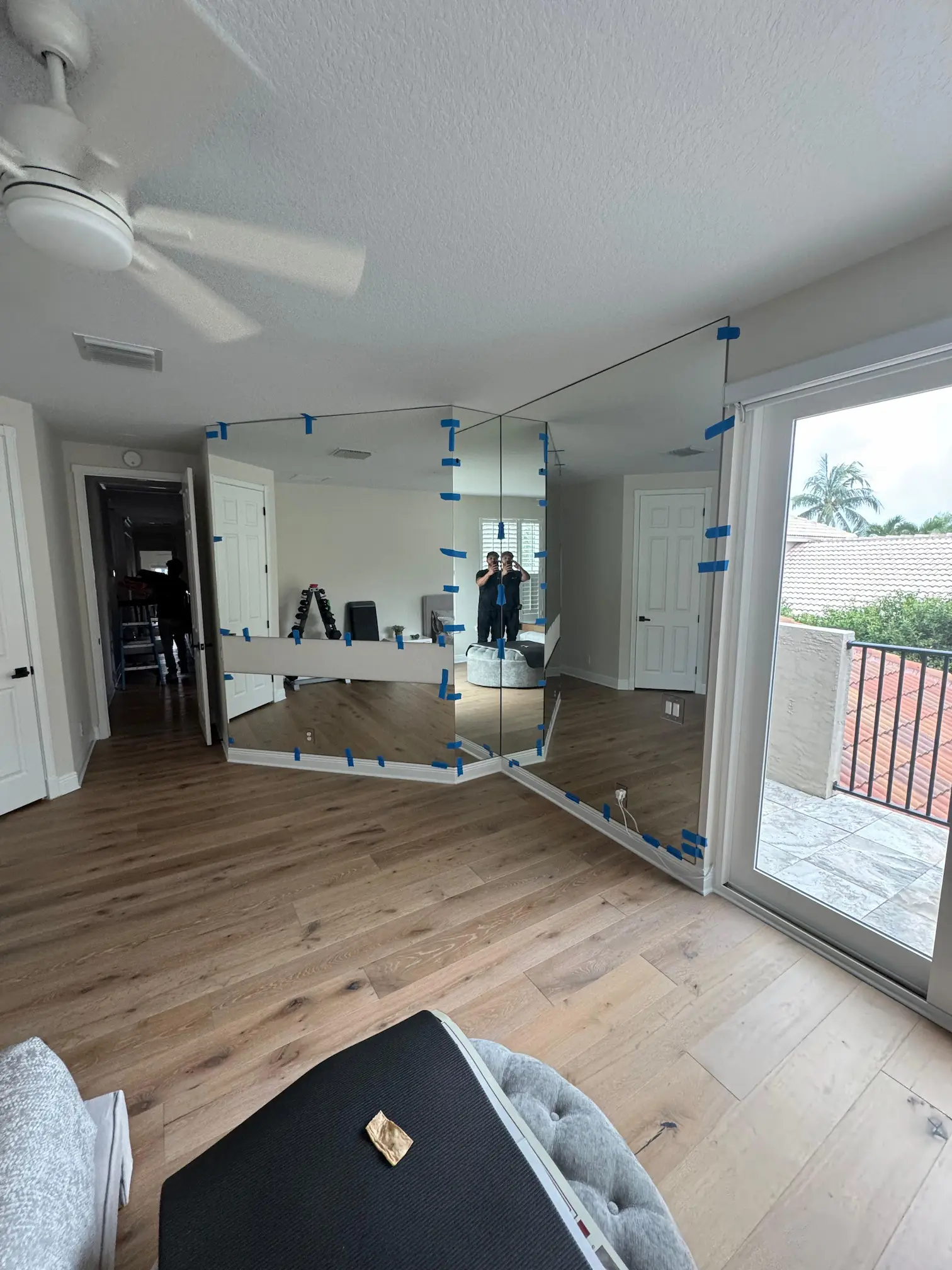 High-quality glass mirror for home decor, featuring a spacious living room with natural light.