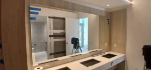 High-quality crystal glass mirror installation in modern bathroom or living space.