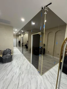 Elegant mirror walls with gold accents for stylish interiors.