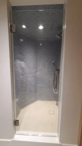 High-quality glass shower enclosure with elegant tile design.