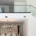 High-quality glass staircase railing with sleek black accents in contemporary home design.