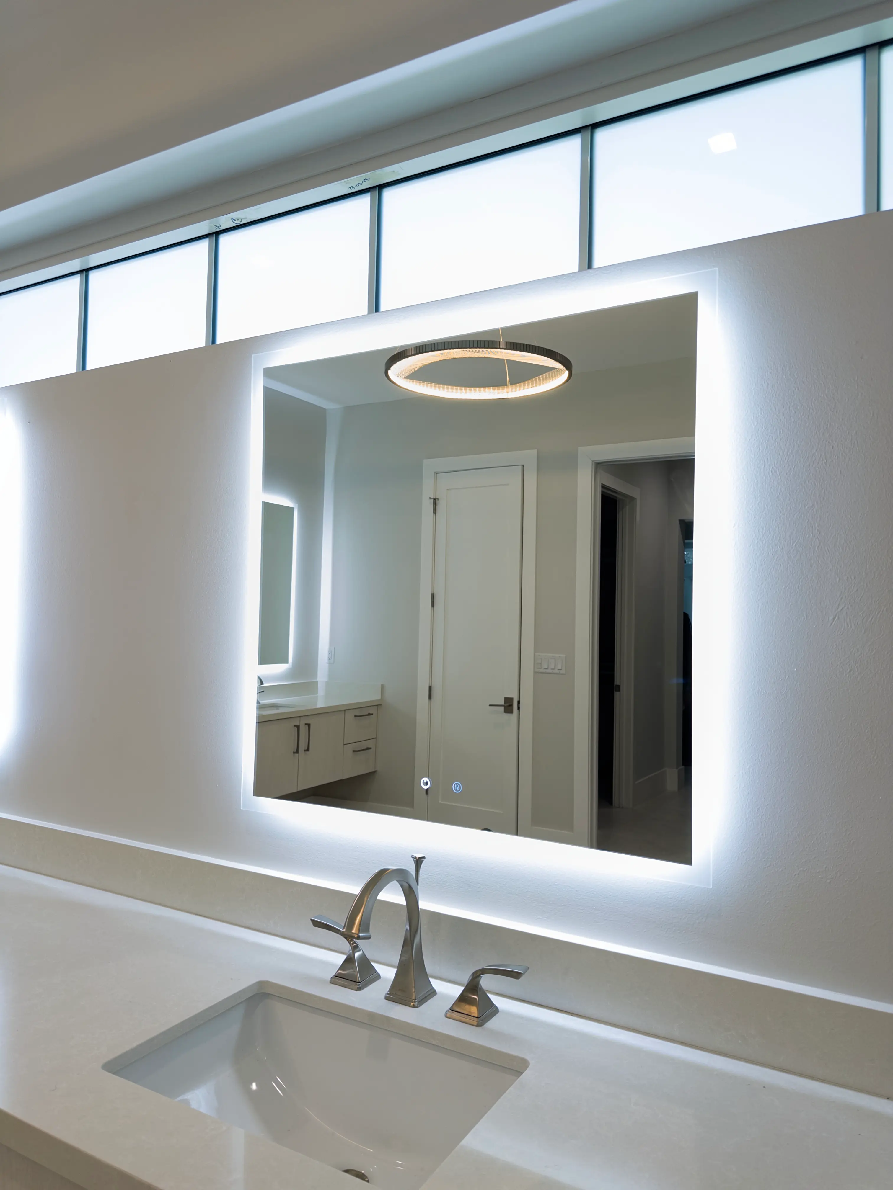 Highly reflective mirror with LED backlighting, perfect for bathroom vanity or bedroom decor.