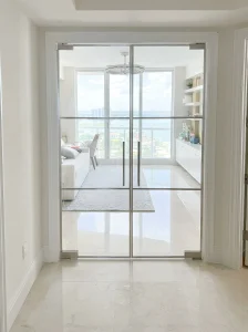 Smooth glass sliding door with mirror for stylish interior design.